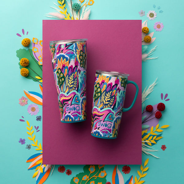 Swig Life Insulated Bazaar 32oz Tumbler and 22oz Travel Mug on a purple background with colorful florals