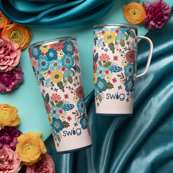 Swig Life Bella Rosa XL Set including a 22oz Travel Mug and a 32oz Tumbler over a blue satin background with flowers