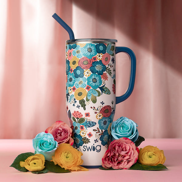 Swig Life Bella Rosa Insulated 40oz Mega Mug on a pink curtain background with colorful flowers