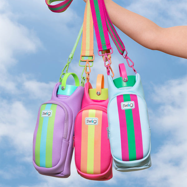 Swig Life Colorblock Water Bottle Sling in Ultra Violet, Prep Rally, and Tutti Frutti against a blue sky