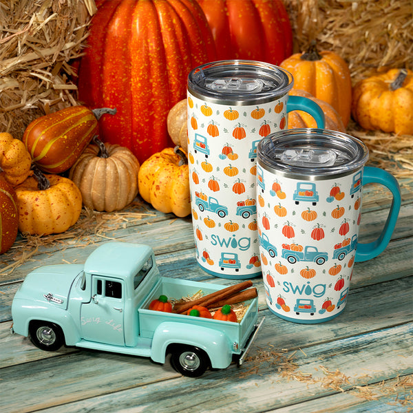 Swig Life Pumpkin Patch 22oz Travel Mug and 18oz Travel Mug surrounded by pumpkins