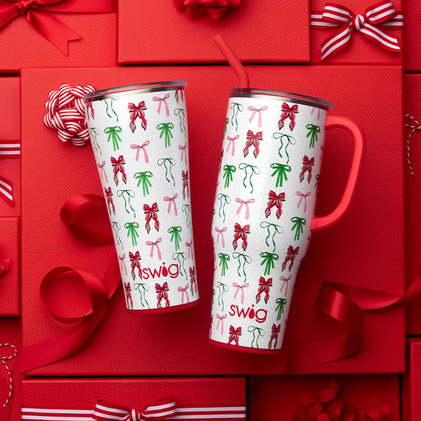 Swig Life Ribbons and Bows Insulated 40oz Mega Mug and 32oz Tumbler surrounded by gifts and red bows