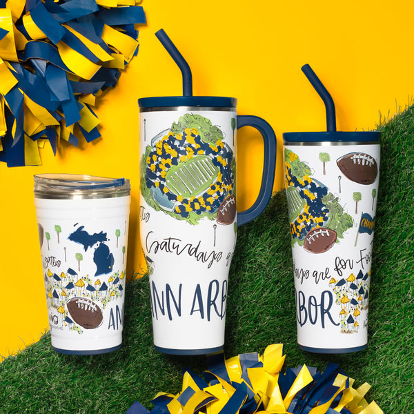 Swig Life Insulated Saturdays in Ann Arbor Drinkware collection on a sports field background