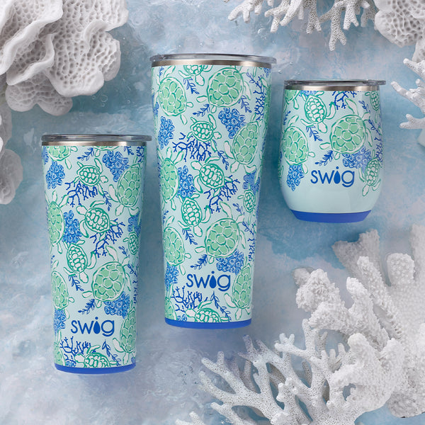 Swig Life Insulated Shell Yeah Drinkware collection on an ocean themed background