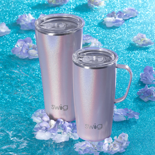 Swig Life Insulated Pixie 22oz Travel Mug and 32oz Tumbler on a blue sparkling background