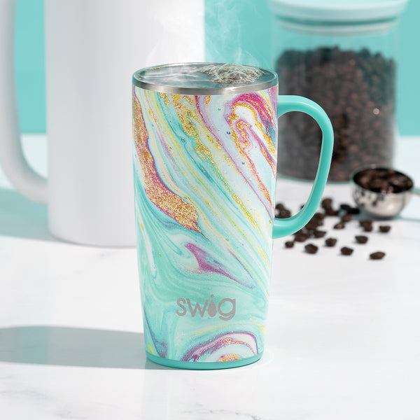 Swig Life Insulated Wanderlust 22oz Travel Mug filled with warm coffee