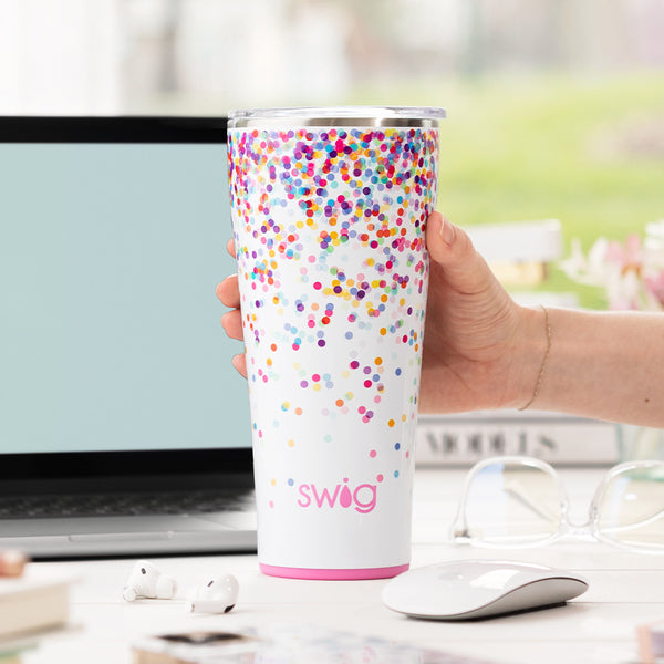 Swig Life 32oz Confetti Insulated Tumbler on a desk