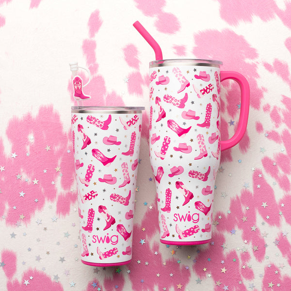 Swig Life Let's Go Girls 32oz Tumbler and 40oz Mega Mug on a pink cowhide background